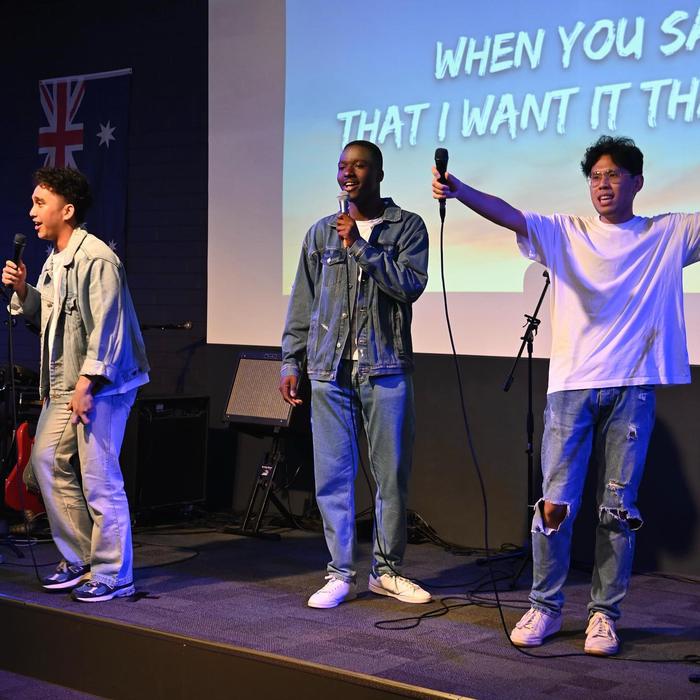 Young people singing on stage
