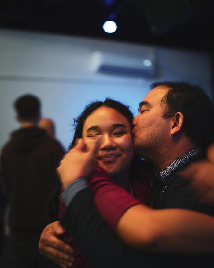 Two church members embracing