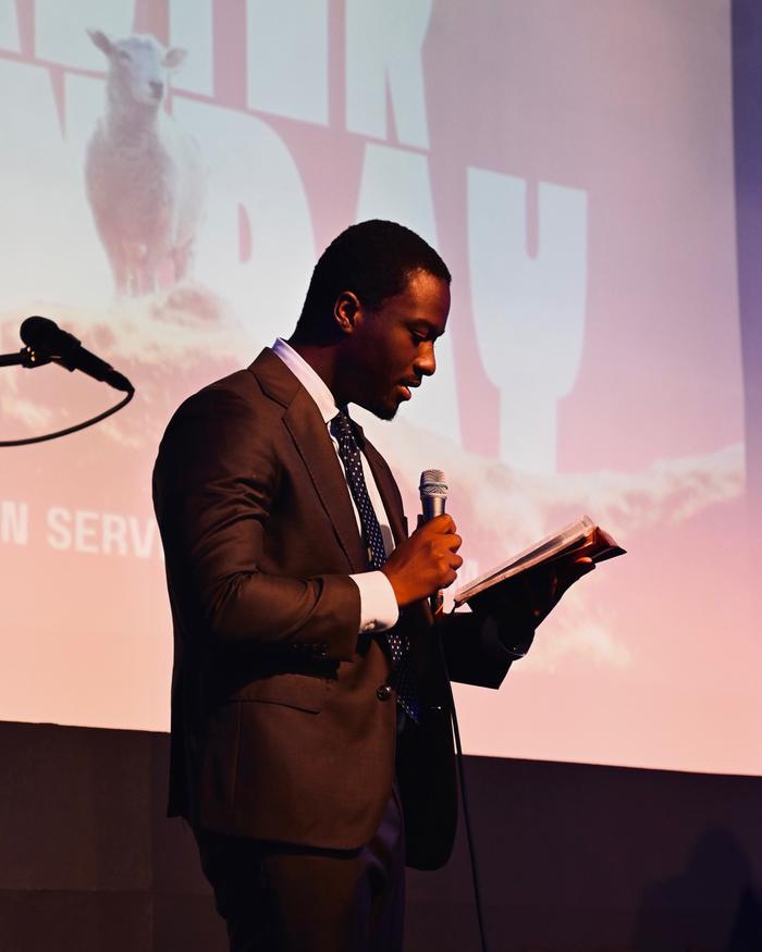 A preacher reading from the Bible