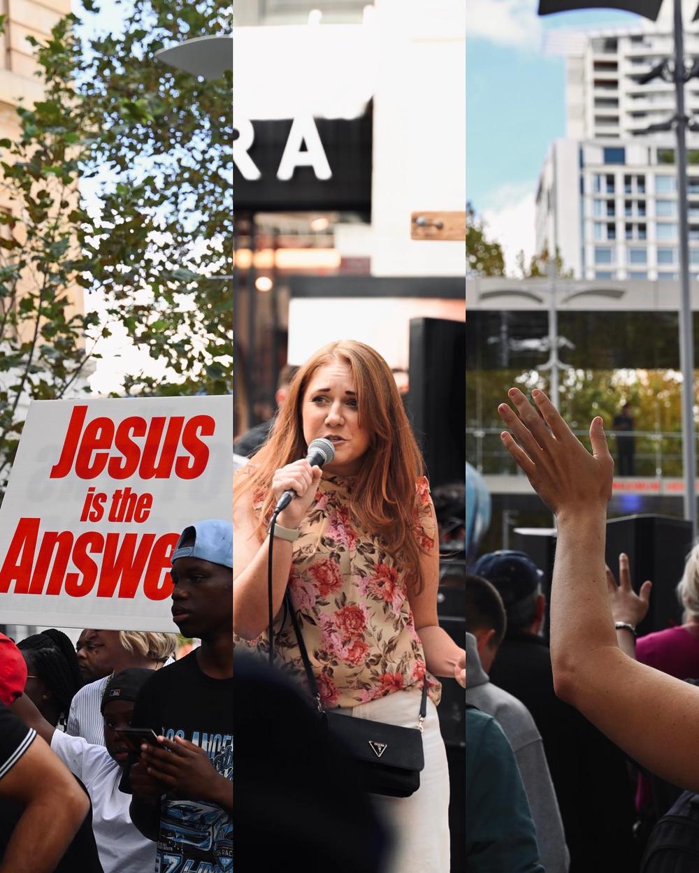 A young woman holding a sign at a street outreach